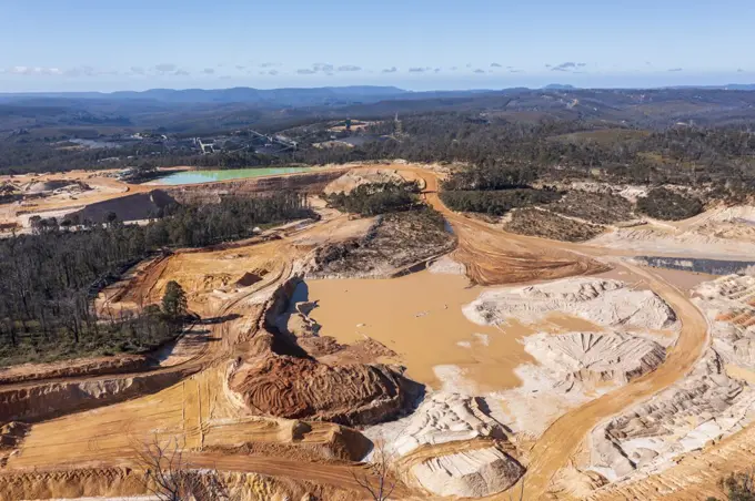 Drone aerial photograph of an industrial Colliery and water reservoirs in a large forest