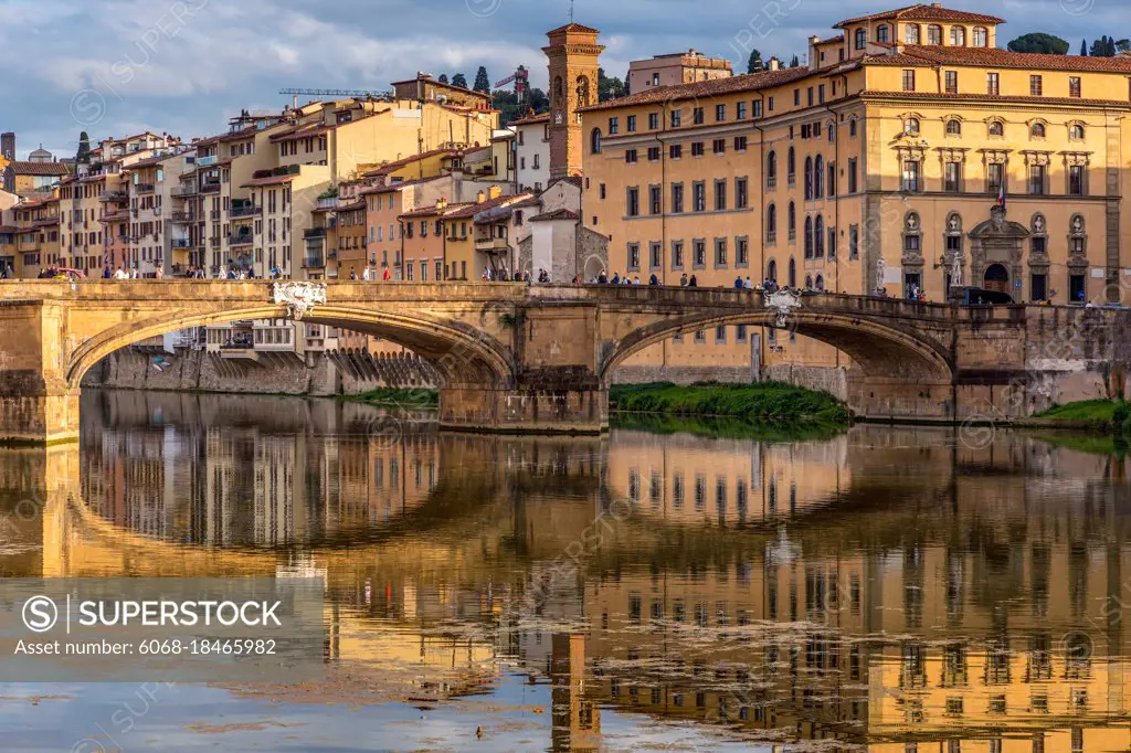 FLORENCE, TUSCANY/ITALY - OCTOBER 18 : View of buildings along and across the River Arno in Florence  on October 18, 2019. Unidentified people.