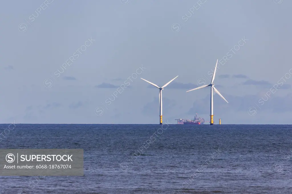 COLWYN BAY, WALES/UK - OCTOBER 7 : Wind turbines off shore at Colwyn Bay Wales on October 7, 2012