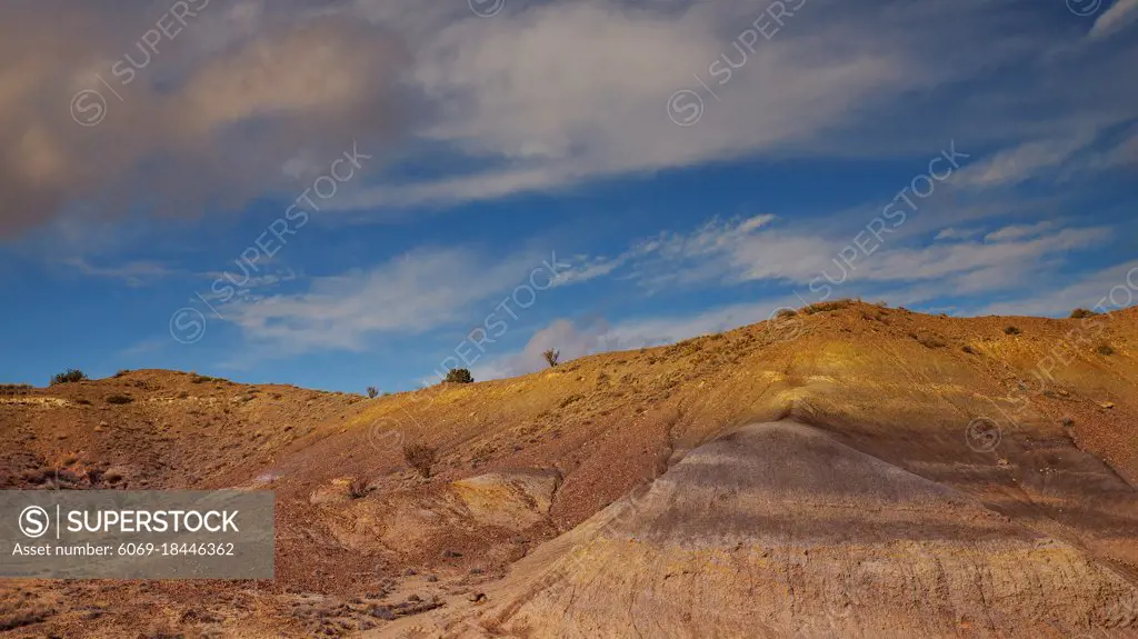 Desert and mountains clouds over the southwestern USA New Mexico desert view of Shiprock rock