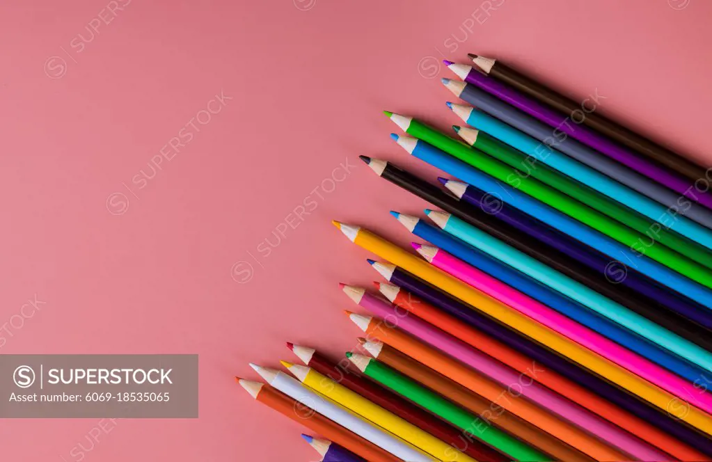 Student material on pink table, back to school