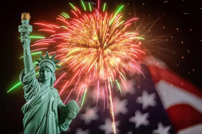 American Symbol Statue of Liberty fireworks in the American flag at 4th of July celebration in the United States