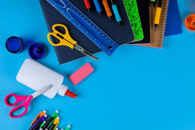 Back to school , school or office supplies on light blue background