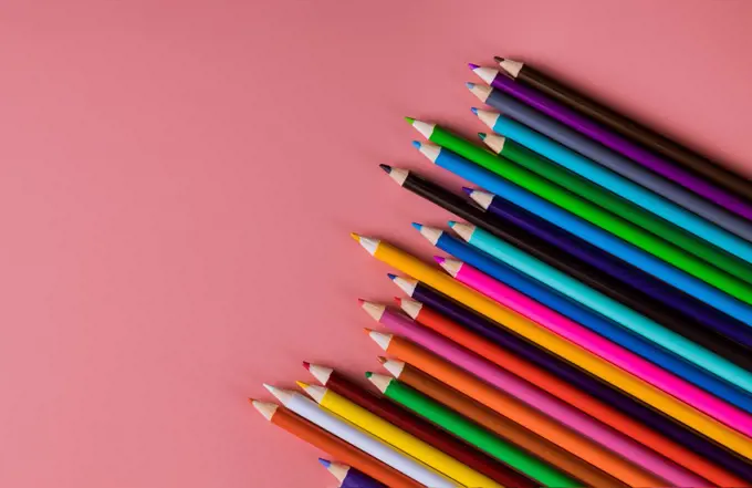 Student material on pink table, back to school