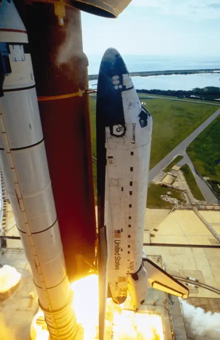 High angle view of a space shuttle taking off from a launch pad, Space Shuttle Discovery, Kennedy Space Center, Cape Canaveral, Florida, USA