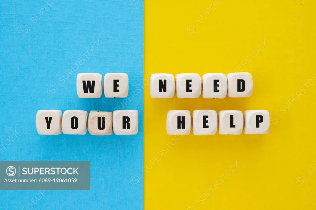 We need your help words written on wooden blocks, abstract