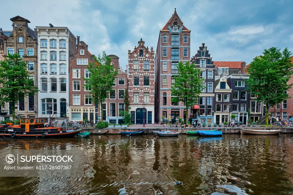 Singel canal in Amsterdam with old houses. Amsterdam, Netherlands