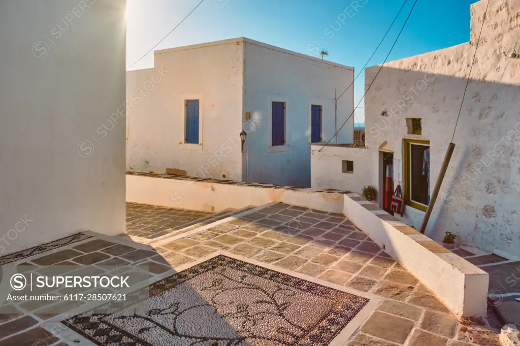 Greek village typical street view with whitewashed houses. Plaka town, Milos island, Greece