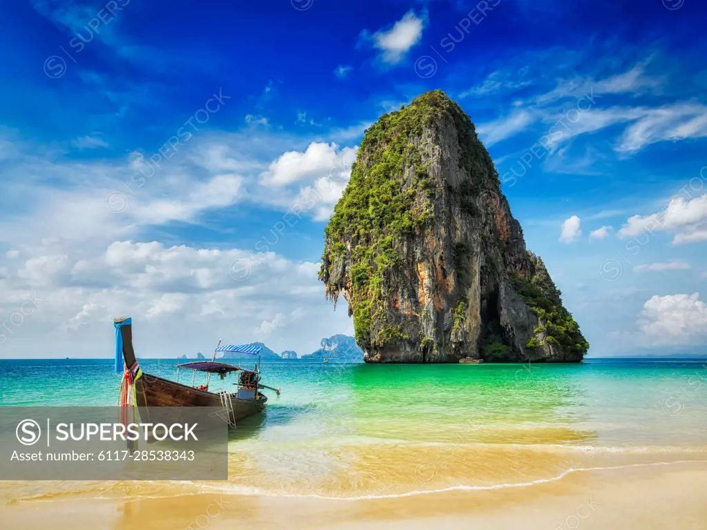 Tropical beach vacation holiday tourism concept - Long tail boat on tropical beach, Krabi, Thailand