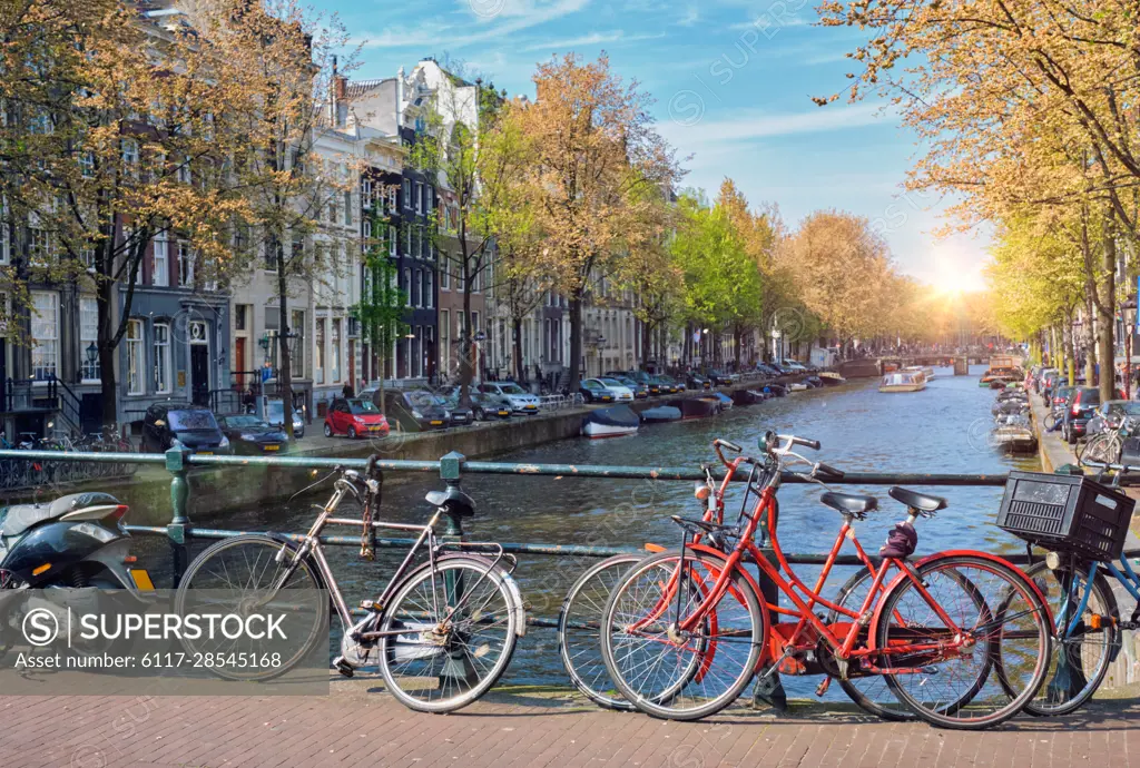 Amsterdam cityscape with canal, bridge with bicycles and medieval houses. Amsterdam, Netherlands