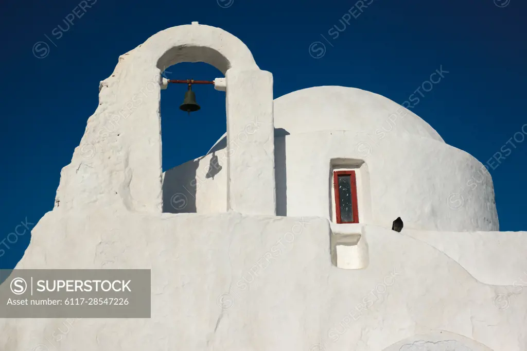 Famous tourist landmark of Greece - Greek Orthodox Church of Panagia Paraportiani in town of Chora on Mykonos island, Greece on sunrise