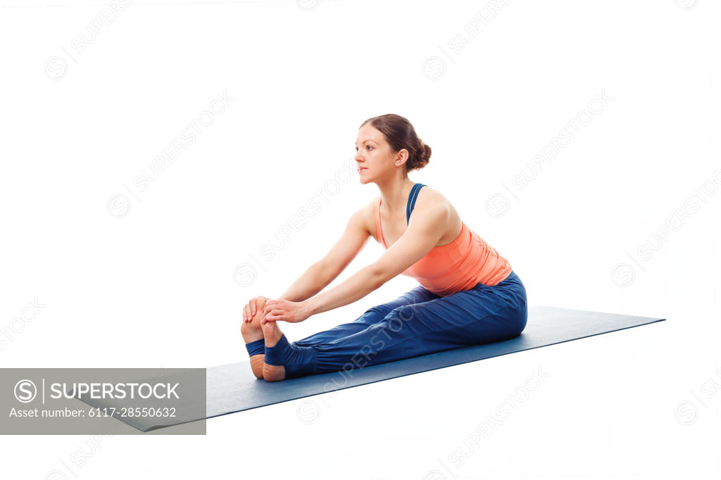 Woman doing Ashtanga Vinyasa yoga asana Parsvottanasana - intense side  stretch pose on yoga mat isolated on white background Stock Photo - Alamy