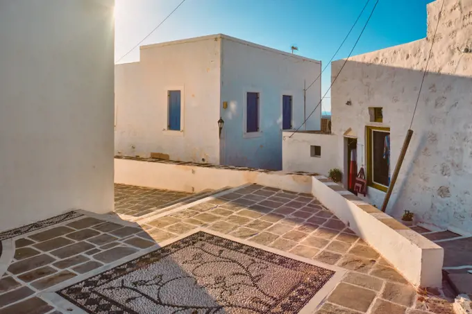 Greek village typical street view with whitewashed houses. Plaka town, Milos island, Greece