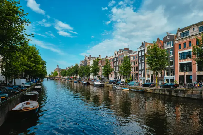 Singel canal in Amsterdam with old houses. Amsterdam, Netherlands