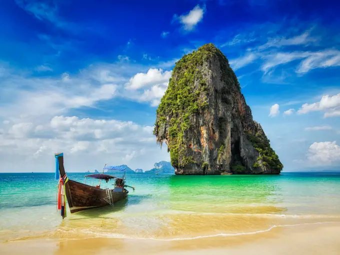 Tropical beach vacation holiday tourism concept - Long tail boat on tropical beach, Krabi, Thailand