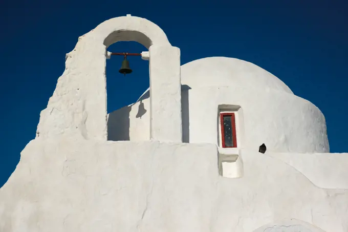 Famous tourist landmark of Greece - Greek Orthodox Church of Panagia Paraportiani in town of Chora on Mykonos island, Greece on sunrise