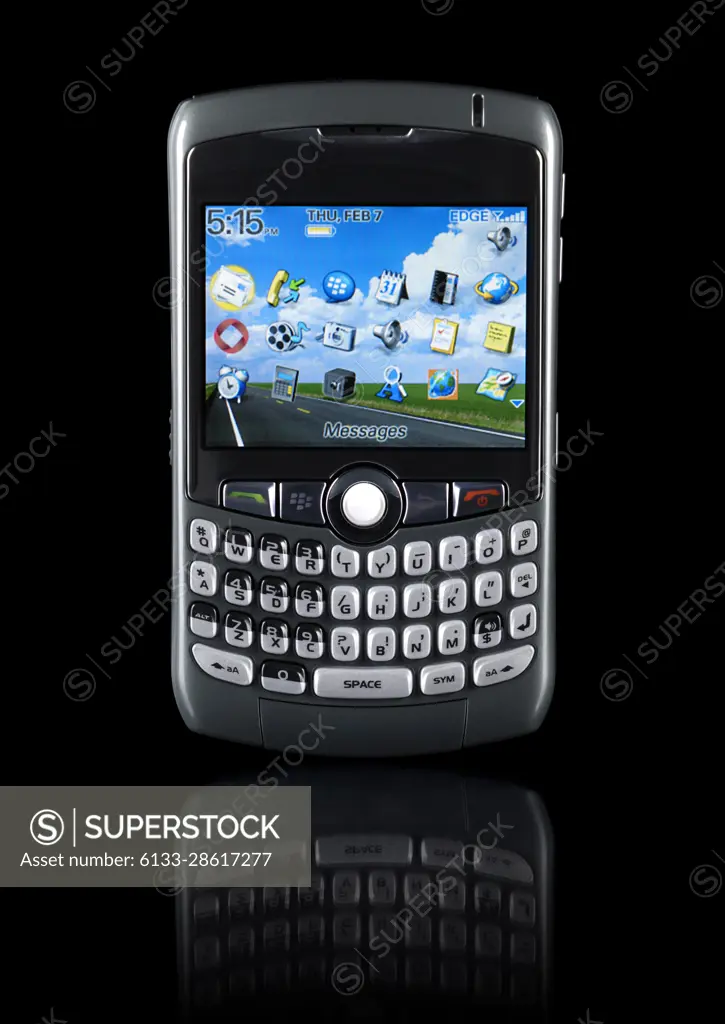 BlackBerry 8310 Curve stylish smartphone with illuminated display Isolated silhouette on black background with clipping path