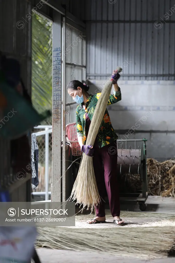 Traditional bamboo and hemp  mat factory.  Woman at work.  Tan Chau. Vietnam.