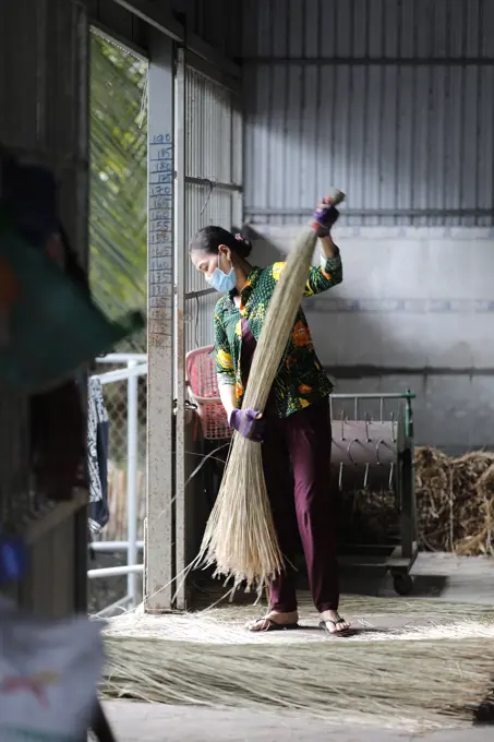 Traditional bamboo and hemp  mat factory.  Woman at work.  Tan Chau. Vietnam.