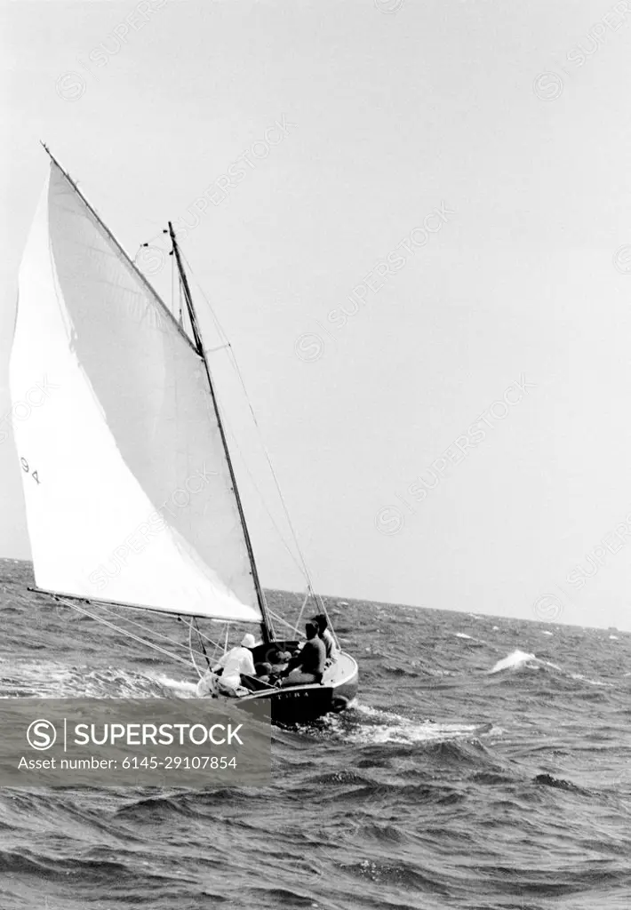 Weekend at Hyannis Port, July 1962: 28-30. President John F. Kennedy and First Lady Jacqueline Kennedy sail aboard the Victura with family friend, Charles Spalding, and others, on Lewis Bay off the coast of Hyannis Port, Massachusetts.