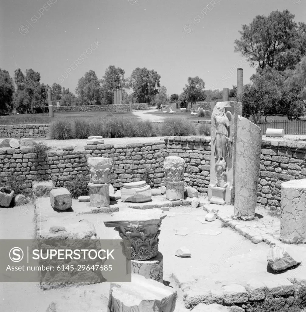 Poll photo collection. Israel 1964-1965: Ashkelon, Archeology. Archaeological site with construction fragments including a picture of the goddess of the Nike or Victoria victory. January 1, 1964. Asjkelon, Israel