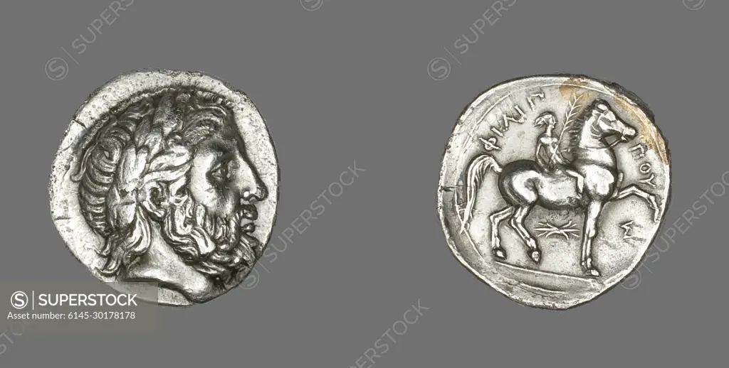 Tetradrachm (Coin) Depicting the God Zeus 348 BCE-336 BCE Pella. Coins were an excellent way for leaders to advertise their victories whether in battle or at the Olympic Games. King Philip (reigned 359ñ336 BCE), father of Alexander the Great, celebrated his win in the horse races at the Olympic Games by issuing this coin, complete with the victory palm in the jockeyís hand.. Silver . Ancient Greek