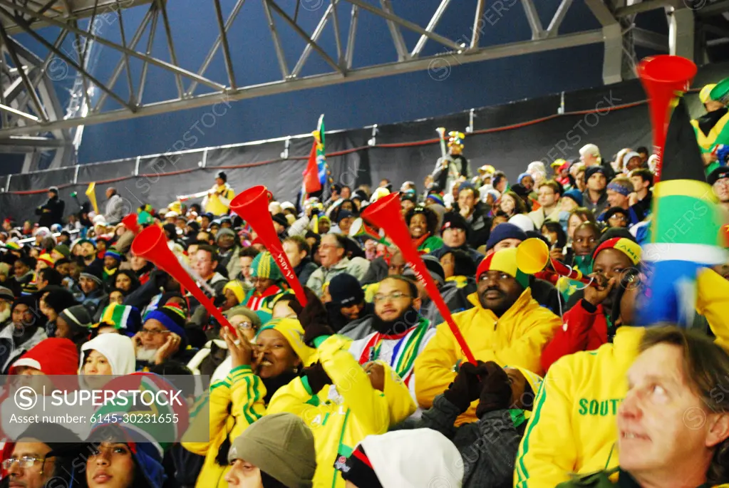 South African fans cheer at the Denmark vs. Cameroon World Cup match at Loftus Versfeld Stadium in Pretoria, South Africa, on June 19, 2010.