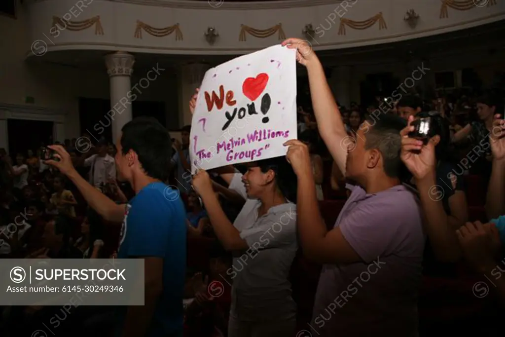 Fans hold up posters during the Melvin Williams Group's concert in Turkmenabat, Turkmenistan, on June 22, 2011. The Melvin Williams Group is visiting Turkmenistan from June 21-26, 2011, as part of the U.S. Embassy�s annual American Culture Days celebration.