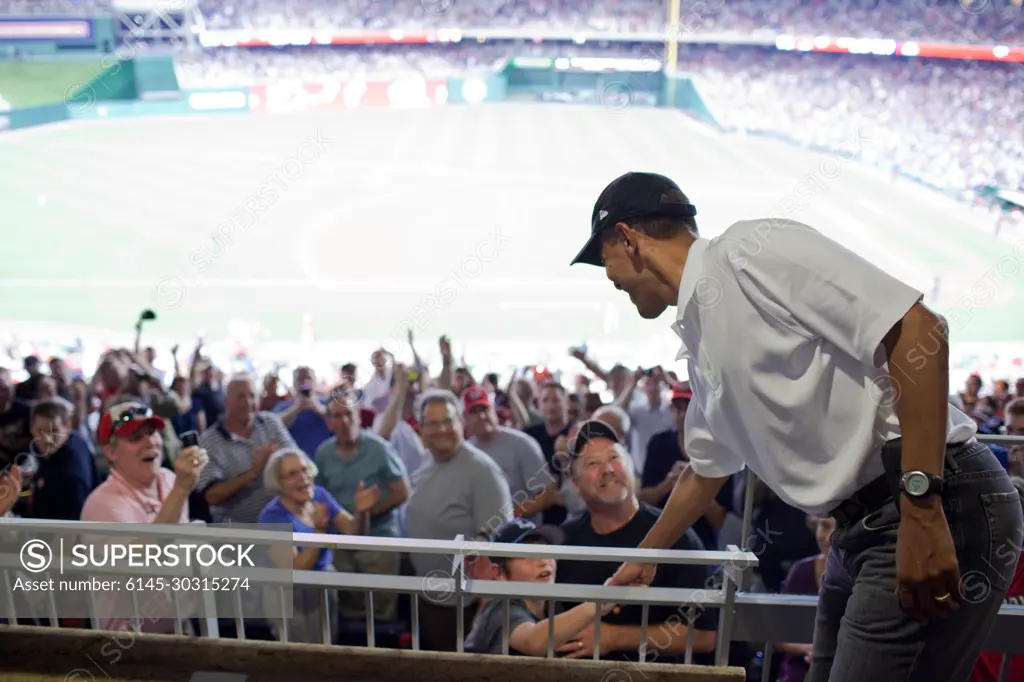 President Barack Obama greets baseball fans during a Washington Nationals vs. Chicago White Sox baseball game at Nationals Park in Washington, D.C., June 18, 2010.