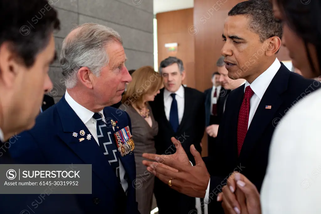 President Barack Obama speaks with Prince Charles following the President's speech at the memorial service at the Normandy American Cemetery in Colleville-sur-Mer, France, on the 65th anniversary of the D-Day landings, June 6, 2009.