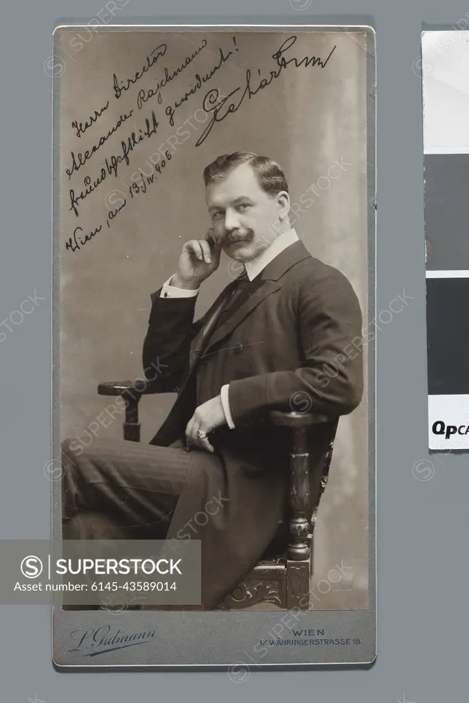﻿Portrait of Franz Lehár (1870-1948), Hungarian composer (sitting in an armchair, view from the knees upwards) - photograph with dedication to Aleksander Rajchman from April 13th, 1906. Gutmann, Ludwig (1869-1943), photographer