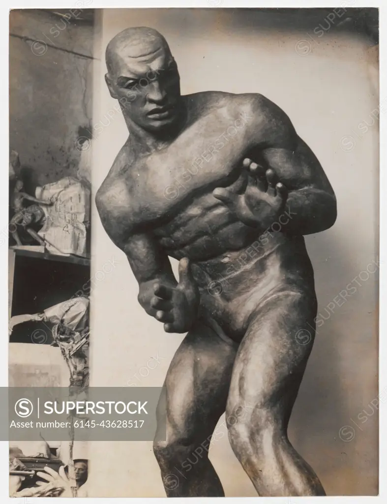 Atleta` The Athlete - Sculpture by Olga Niewska photograph of sculpture at  the workshop.. Koch, Edward (fl. ca 1930-ca 1939), photographer - SuperStock