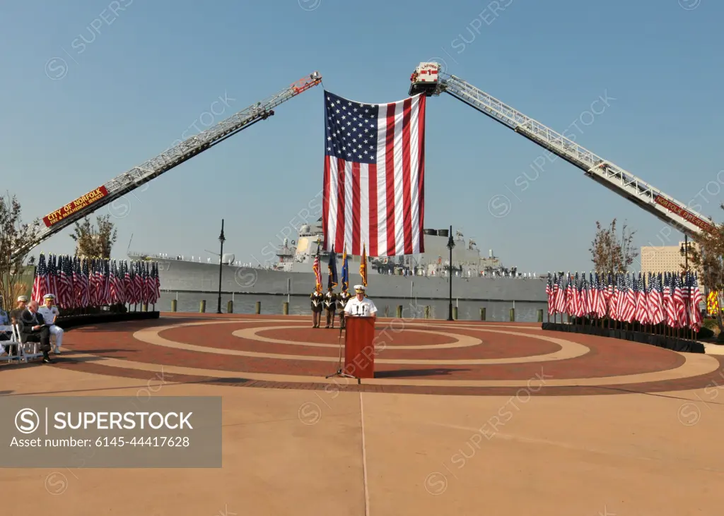 110911-N-NL541-339NORFOLK (Sept. 11, 2011) Adm. John C. Harvey Jr. addresses the citizens of the City of Norfolk in front of the guided-missile destroyer USS Cole (DDG 67) during a 9/11 Remembrance ceremony at Town Point Park. The City of Norfolk hosted an all-day healing and remembrance ceremony to mark the 10th anniversary of the Sept. 11, 2001, terrorist attacks on the U.S.