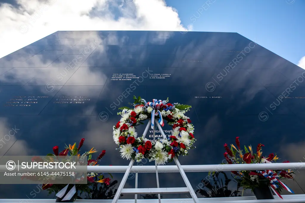 A wreath is placed in front of the Space Mirror Memorial at NASAs Kennedy Space Center Visitor Complex during the NASA Day of Remembrance on Jan. 27, 2022. Kennedy Space Center in Florida paid tribute to the crews of Apollo 1 and space shuttles Challenger and Columbia, as well as other astronauts who lost their lives while furthering the cause of exploration and discovery.