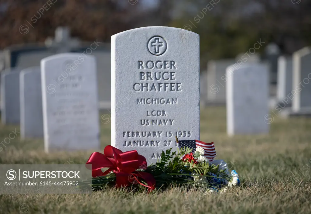 The grave marker of Roger Chaffee, from Apollo 1, is seen after a wreath laying ceremony that was part of NASA's Day of Remembrance, Thursday, Jan. 27, 2022, at Arlington National Cemetery in Arlington, Va.  Wreaths were laid in memory of those men and women who lost their lives in the quest for space exploration.