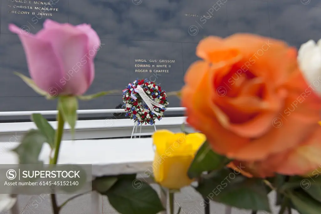 Flowers are placed near the Space Mirror Memorial at the Kennedy Space Center Visitor Complex. The names of fallen astronauts from Apollo 1, Challenger and Columbia, as well as the astronauts who perished in training and commercial airplane accidents are emblazoned on the monument. During the annual Day of Remembrance, spaceport employees and guests join others throughout NASA honoring the contributions of astronauts who have perished in the conquest of space.