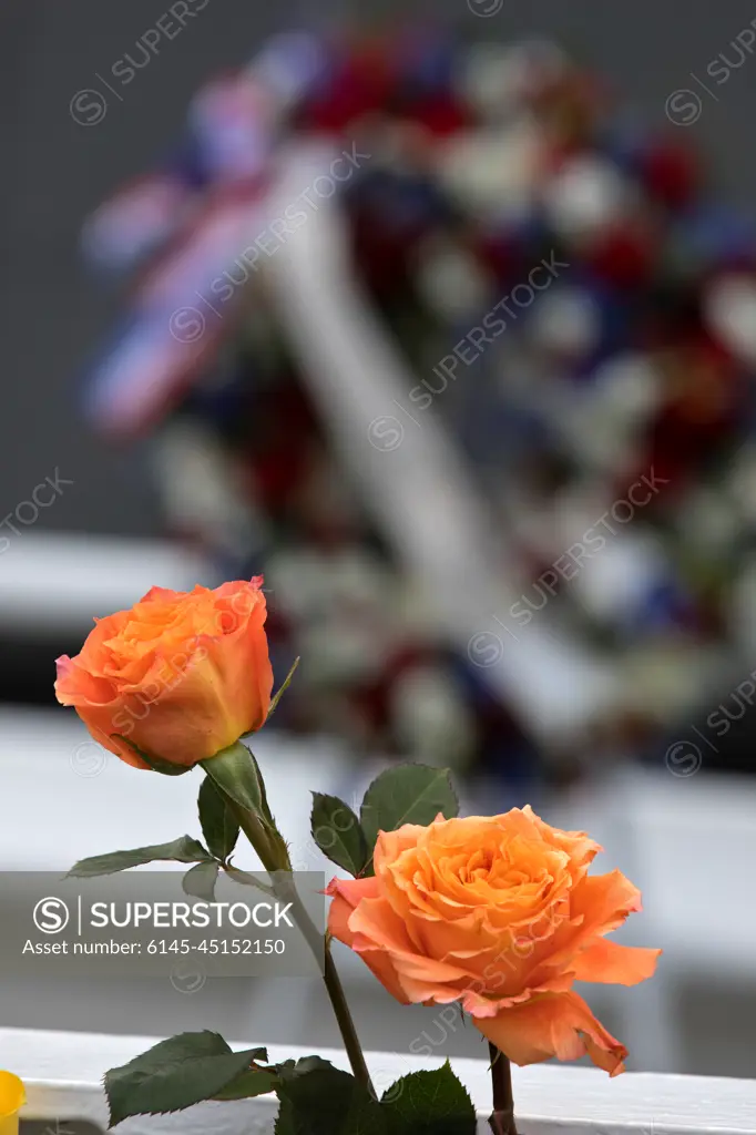 Flowers are placed near the Space Mirror Memorial at the Kennedy Space Center Visitor Complex. The names of fallen astronauts from Apollo 1, Challenger and Columbia, as well as the astronauts who perished in training and commercial airplane accidents are emblazoned on the monument. During the annual Day of Remembrance, spaceport employees and guests join others throughout NASA honoring the contributions of astronauts who have perished in the conquest of space.