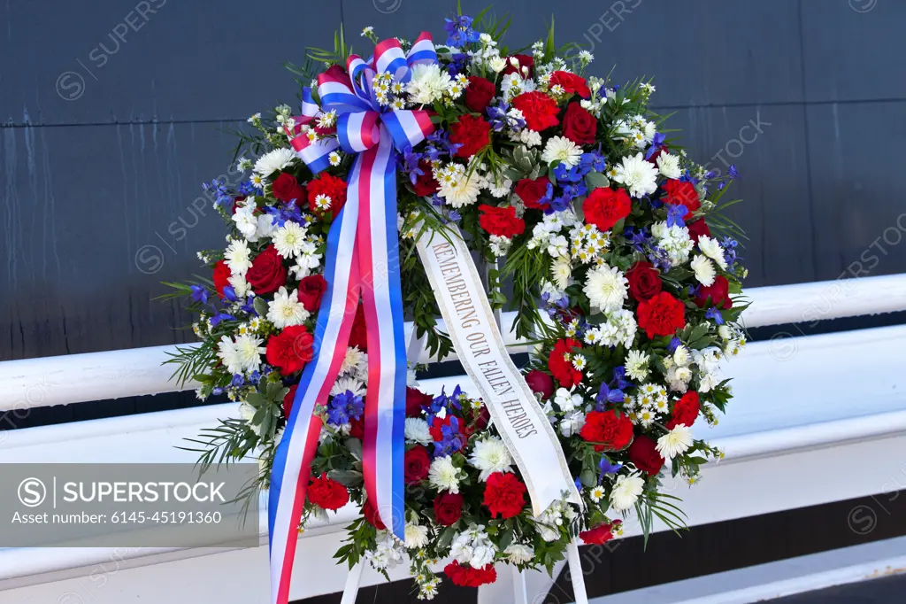 A memorial wreath stands before the Space Mirror Memorial at the Kennedy Space Center Visitor Complex during this years Day of Remembrance ceremony. Each year, Kennedy employees and guests gather with others throughout NASA to honor those astronauts who have fallen in the pursuit of space exploration.