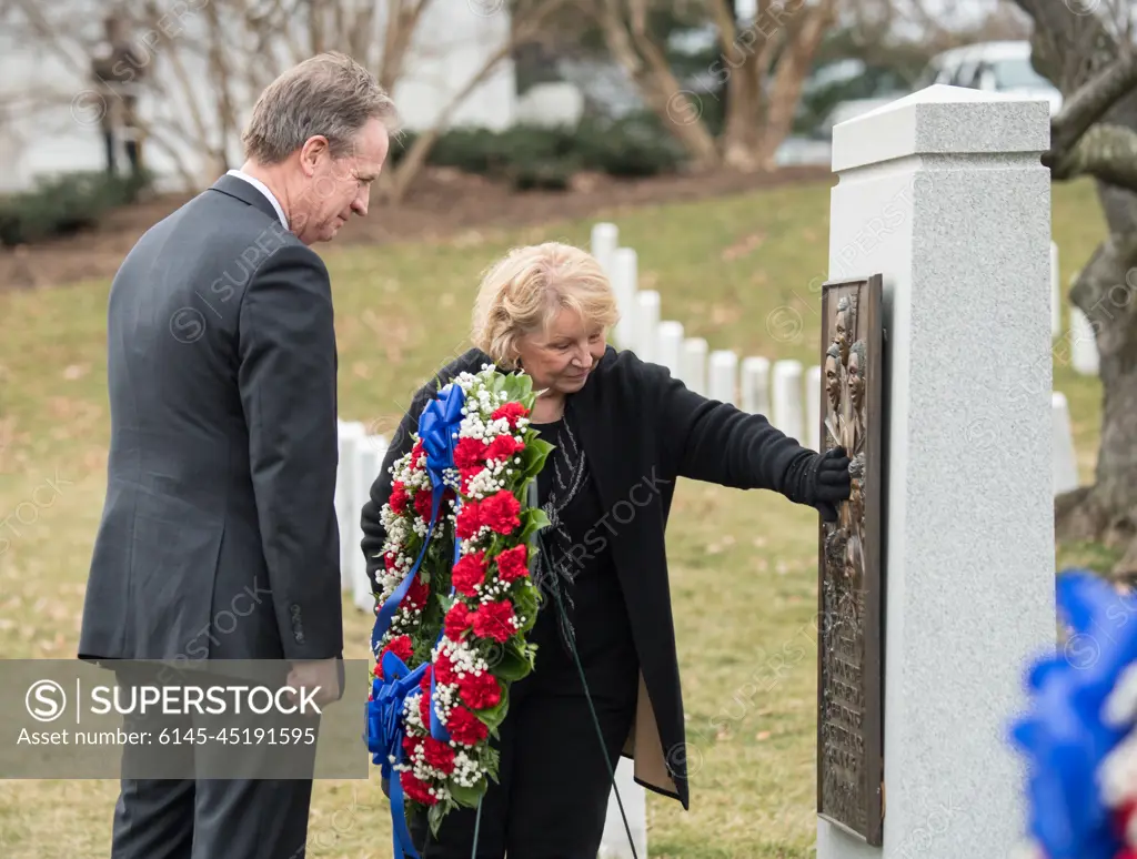 John Warnack, left, and June Scobee-Rodgers, widow of Challenger Commander Dick Scobee, visit the Space Shuttle Challenger Memorial after a wreath laying ceremony that was part of NASA's Day of Remembrance, Thursday, Feb. 7, 2019, at Arlington National Cemetery in Arlington, Va. Wreaths were laid in memory of those men and women who lost their lives in the quest for space exploration.