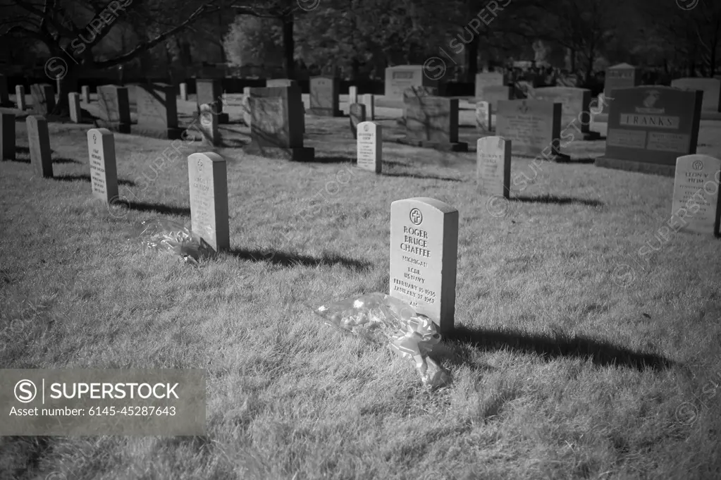 The grave markers of Roger Chaffee, and Virgil "Gus" Grissom and from Apollo 1, are seen in this black and white infrared photograph after a wreath laying ceremony that was part of NASA's Day of Remembrance, Thursday, Jan. 28, 2021, at Arlington National Cemetery in Arlington, Va.  Wreaths were laid in memory of those men and women who lost their lives in the quest for space exploration.