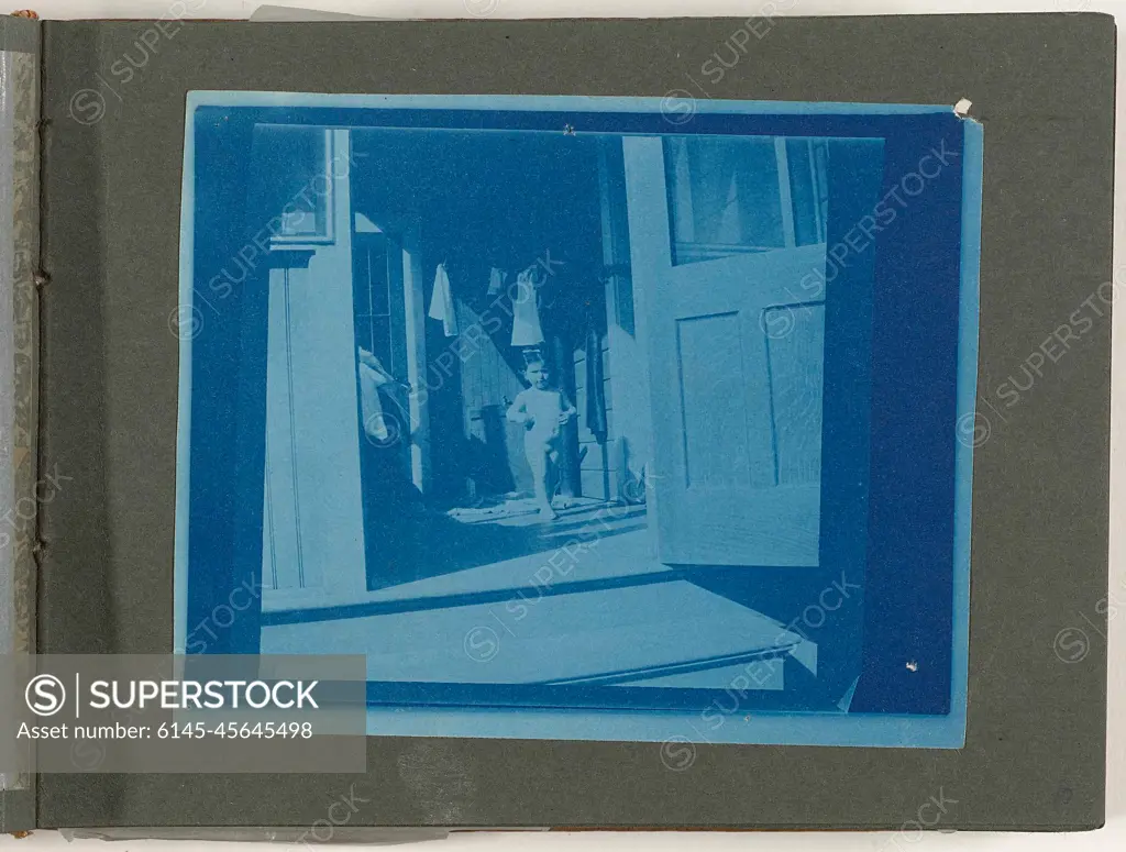 Child, nude, on veranda, Pleasure Island Camp, Cupsuptic Lake, Maine,  United States. - SuperStock