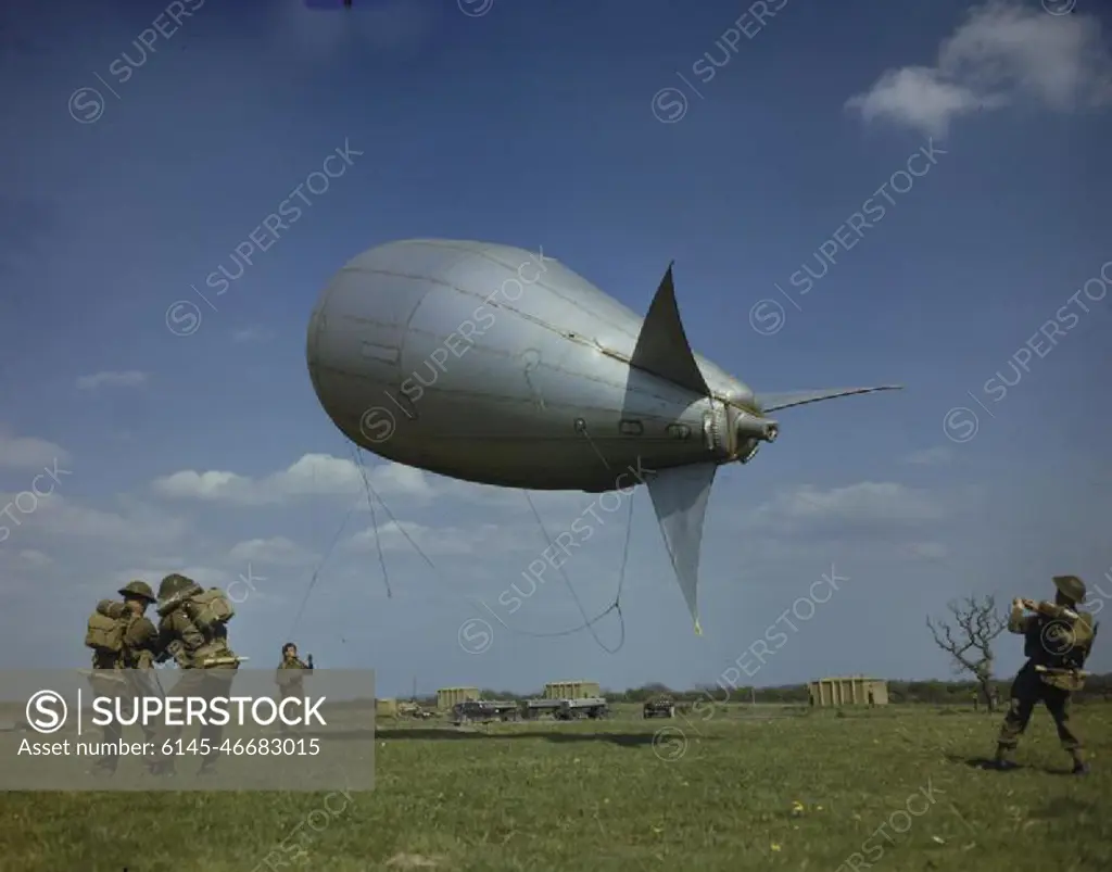 Royal Air Force Balloon Crew in Britain, 1944 Royal Air Force Combined Operations balloon crew hauling in a small barrage balloon of the type used during the D-Day landings.