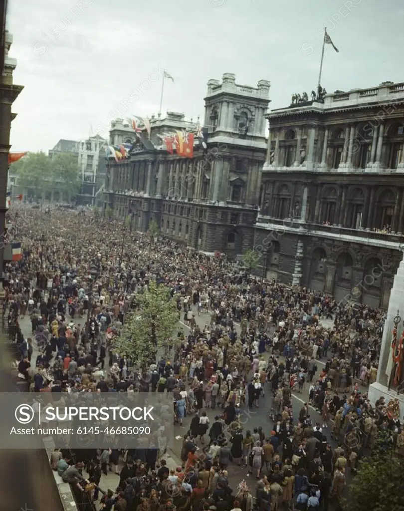 Ve Day Celebrations in London, 8 May 1945 View of the crowd in front of the Ministry of Health building in Whitehall. The Prime Minister addressed the crowd from the balcony, which, like the roof of the building, is decorated with flags. On the right is the Cenotaph.