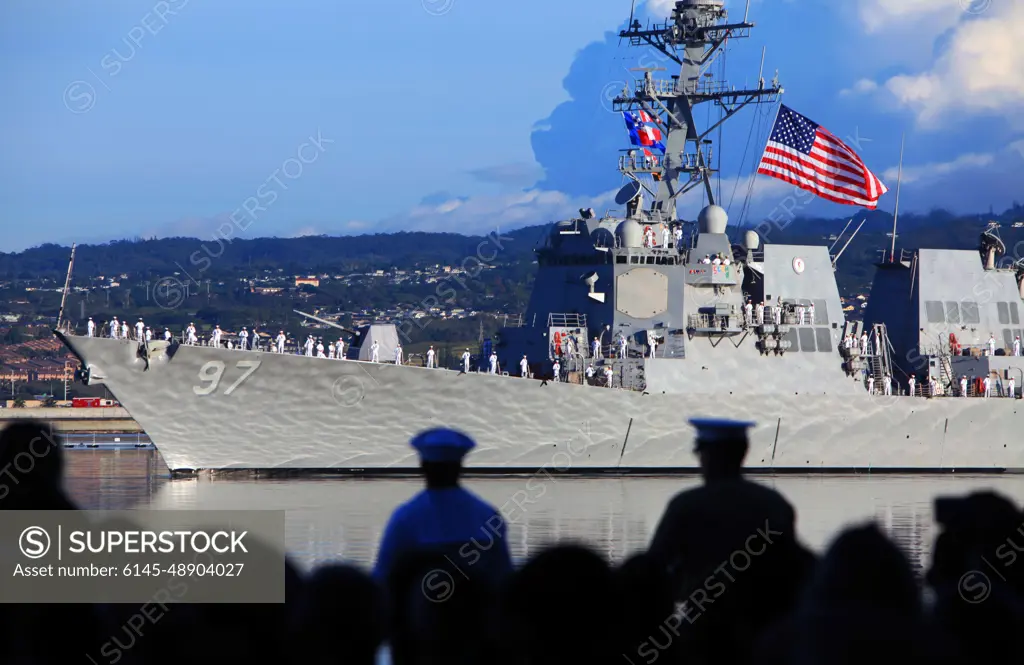 The USS Halsey (DDG-97) conducts a pass-in-review during the 75th National Pearl Harbor Remembrance Day Commemoration Ceremony at Joint base Pearl Harbor-Hickam, Hawaii, Dec. 7, 2016. Civilians, veterans, and service members came together to remember and pay their respect to those who fought and lost their lives during the attack on Pearl Harbor.