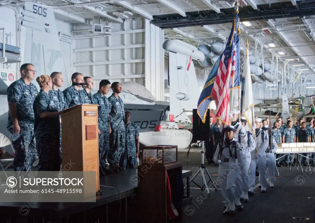 PACIFIC OCEAN (Sept. 11, 2012) The color guard aboard the aircraft carrier USS George Washington (CVN 73) presents the colors during a Patriot Day remembrance of the events of Sept. 11, 2001.  George Washington and its embarked air wing, Carrier Air Wing (CVW) 5, provide a combat-ready force that protects and defends the collective maritime interest of the U.S. and its allies and partners in the Asia-Pacific region.