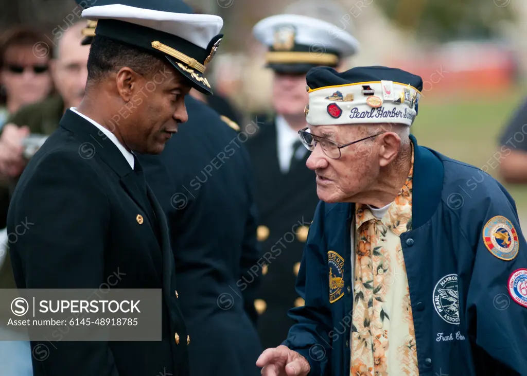 111207-N-OV802-055VIRGINIA BEACH, Va. (Dec.7, 2011) Frank Chebetar, president of the Pearl Harbor Survivors Association, Tidewater Chapter 2, speaks with Capt. Charles L. Stuppard, base commander of Joint Expeditionary Base Little Creek-Fort Story, before a Pearl Harbor remembrance ceremony. The Pearl Harbor Survivors Association, founded in 1958, is an organization dedicated to the remembrance of the attacks on Pearl Harbor and those who gave their lives that day.