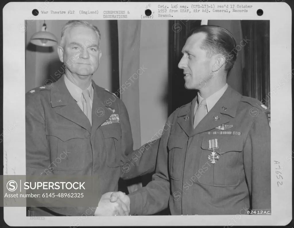 Lt. Colonel Burton R. Baldwin Of The 9Th Troop Carrier Command Is  Congratulated By Major General Paul L. Williams After Receiving The Dfc At  A Ceremony At An Airbase Somewhere In England.