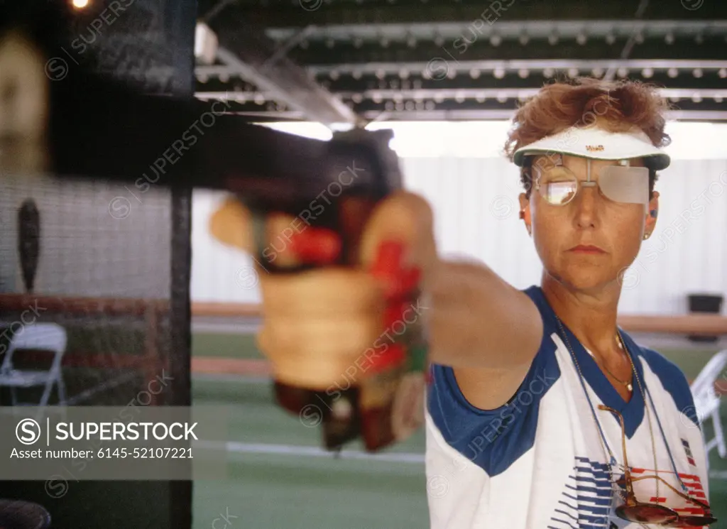 Army SPECIALIST 5 Ruby E. Fox from Parker, Arizona, participates in the sport pistol competition at the 1984 Summer Olympics. She won a silver medal for her performance in the event. Base: Chino State: California (CA) Country: United States Of America (USA)