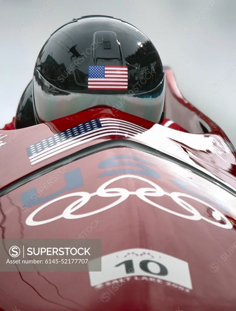 Competing in the 2002 OLYMPIC WINTER GAMES debut for womens bobsledding, World Class Athlete SPECIALIST Jill Bakken, USA, drives the "USA-2" bobsled for the first of two runs in the event. The team was not favored going in but ended up breaking a 46 year drought for the United States and winning the Gold over another American team and favored German team, setting a track record in the process. Subject Operation/Series: 2002 OLYMPIC WINTER GAMES Base: Park City State: Utah (UT) Country: United States Of America (USA)