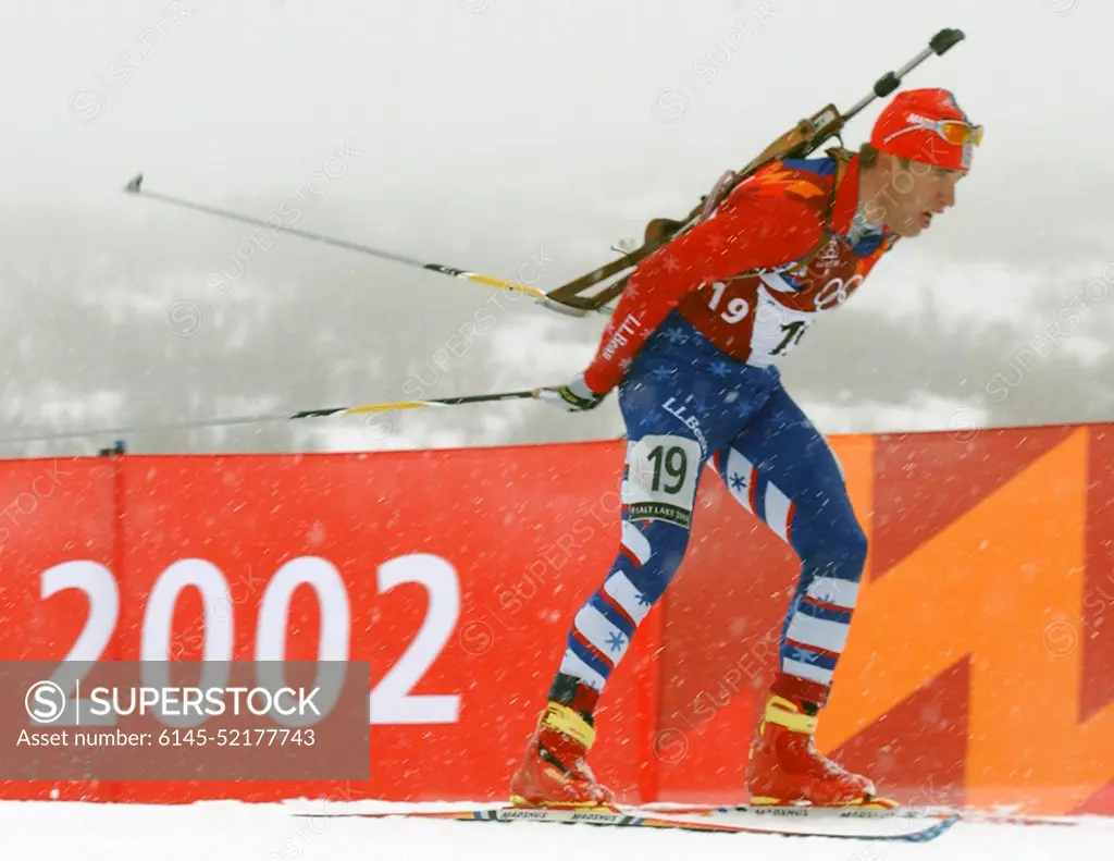 With his .22 caliber, bolt-action rifle slung on his back, World Class Athlete SPECIALIST Jeremy Teela, USA, works his way around the course, on skis, during the first leg of the men's 4 x 7.5km Biathlon Relay competition at Soldier Hollow in Midway, Utah, during the 2002 WINTER OLYMPIC GAMES. The Relay competition consists of four team members; each must ski 7.5 km, with two firing bouts, one prone and one standing, each bout with unsupported rifle. The United States would finish the race in 15th place, 6:44.8 behind the leader. Subject Operation/Series: 2002 WINTER OLYMPIC GAMES Base: Midway State: Utah (UT) Country: United States Of America (USA)